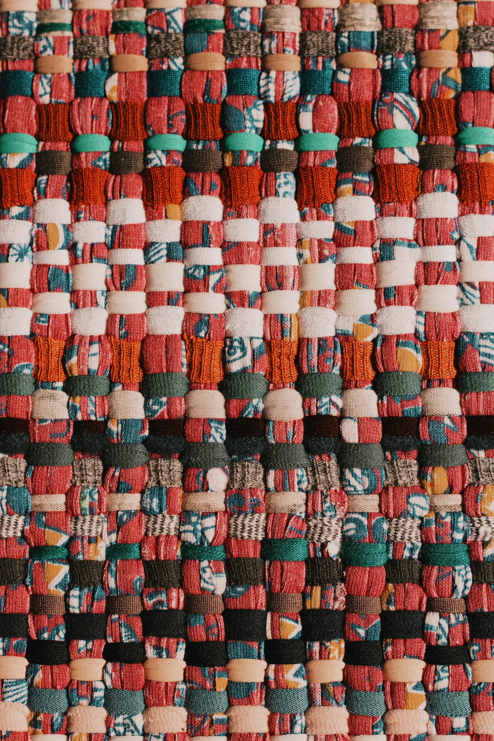 Woven multi-coloured textiles used for material sourcing in interior design.